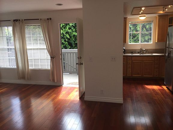 Partial view of living room and kitchen.