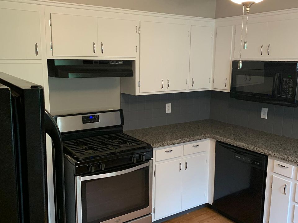 Updated kitchen with gas stove, microwave, dishwasher and refrigerator.