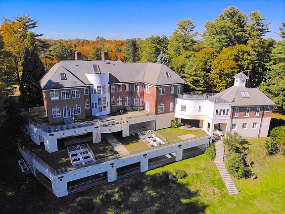 Rear view of the home showing the 4 dynamic levels and how the home is situated on a knoll.