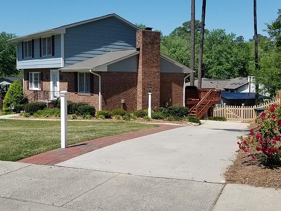 Nice walkway that has solar lighting and a Post light. The rear yard is completely fenced and has all new fencing. The end of the driveway has stairs to the rear deck that leads to the family room and kitchen making it easy to bring in the groceries.