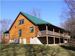 Back of cabin overlooks valley and creek