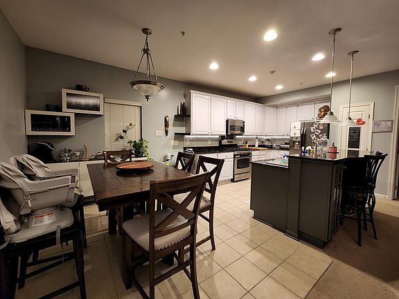 Recently painted Kitchen Cabinets and backsplash (2021) with room for breakfast table