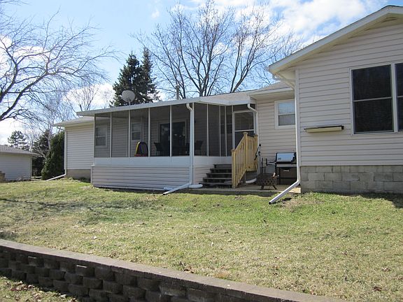 Back of house - 3 season's room and brick patio