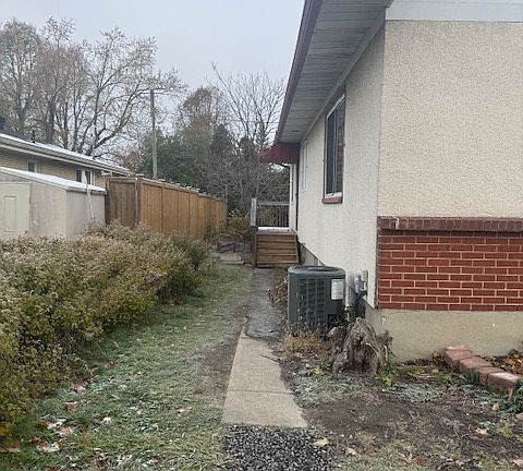 Side door entrance to basement apartment