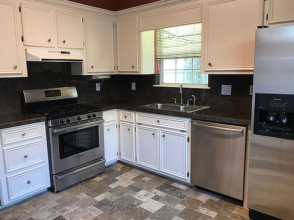 Kitchen with nice gas stove.