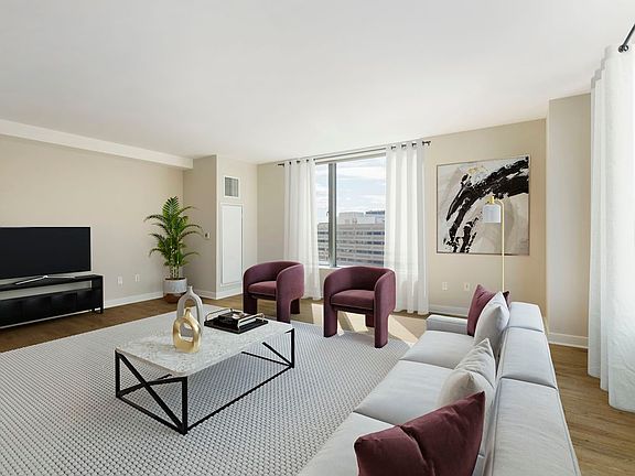 Renovated Package I living room with hard surface flooring