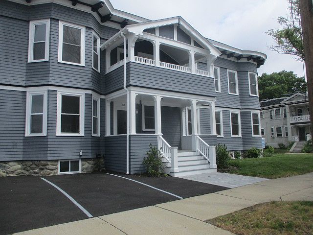 Building front. Unit 2 has a private upper deck. Free off street parking.