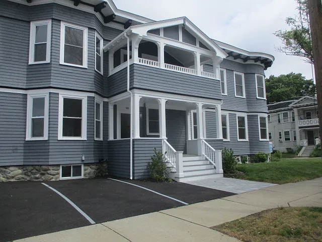 Building front. Unit 2 has a private upper deck. Free off street parking. Bathed in natural sunlight.