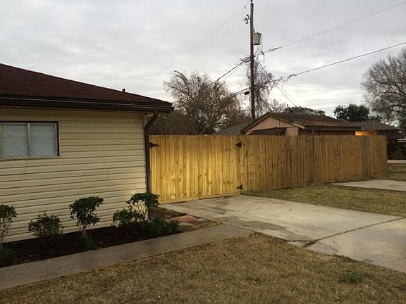 Wooden Fence and Driveway
