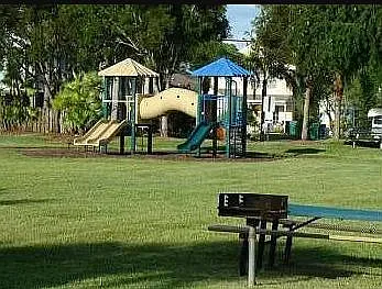 Playground in the community with lots of green space.