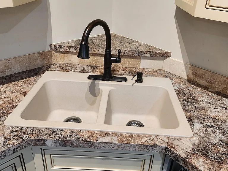 Double Stone Sink with Antique Bronze Delta Faucet