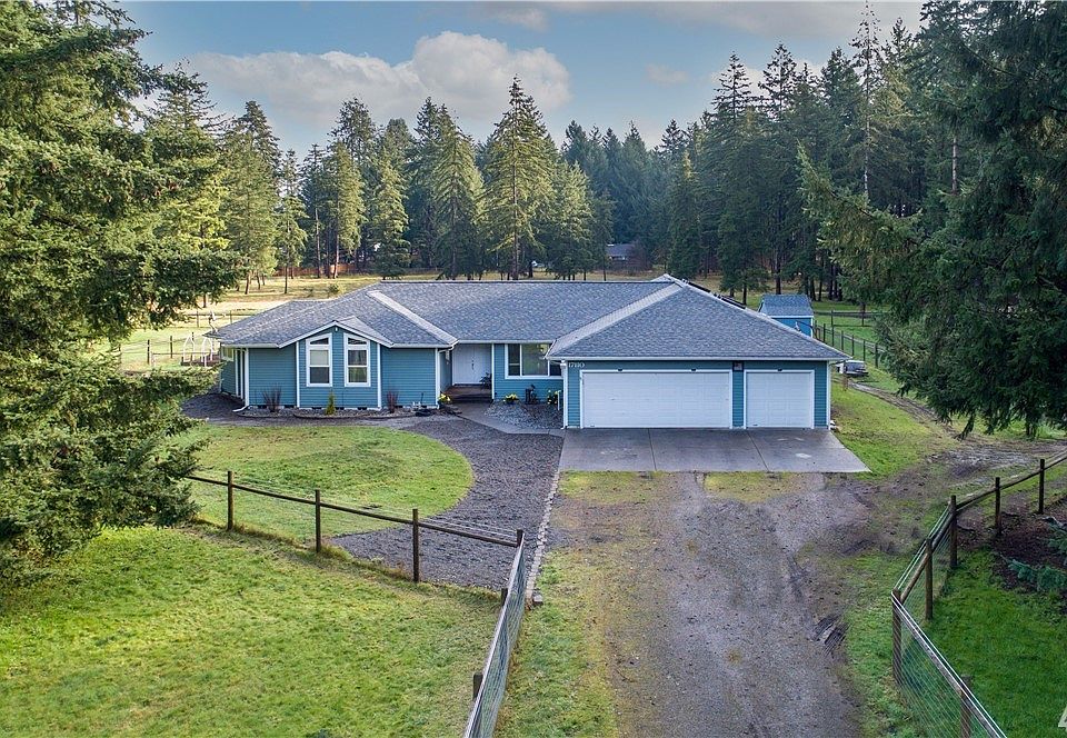 Beautiful Rambler on 5 acres. 3bedroom + office, 2 baths, 3-car garage. 3 fenced pastures and tons of garden space