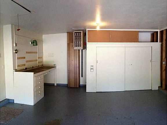 2 car garage with workbench and extra storage.
