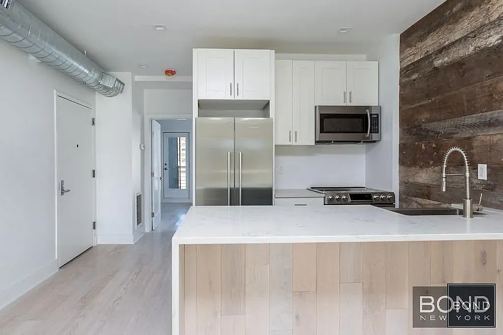11-49 Welling Court — Photo 1