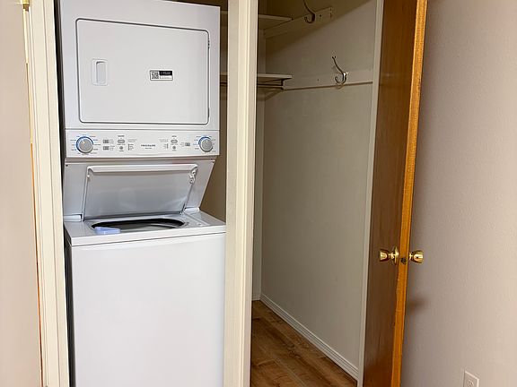 Closet and washer/dryer in bedroom