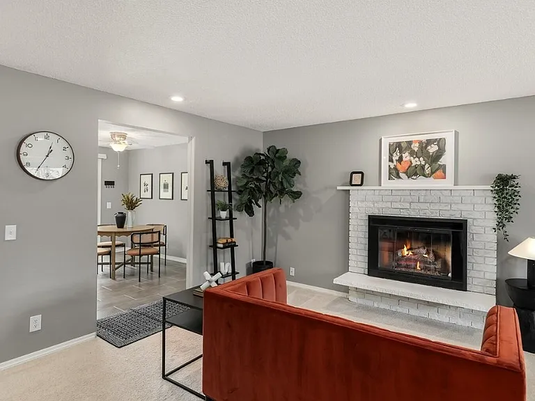Living room with gas fireplace insert.