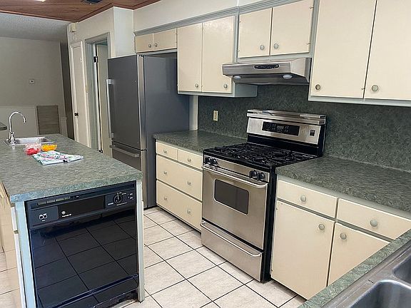 Enter home into kitchen