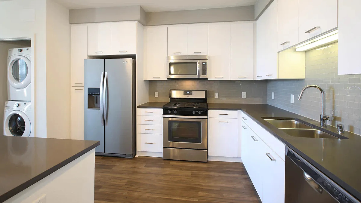 Kitchen with Stainless Steel Appliances and In-home Washer and Dryer - The Alton