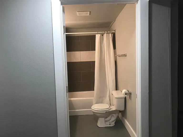 Bathroom is centrally located in the apartment.