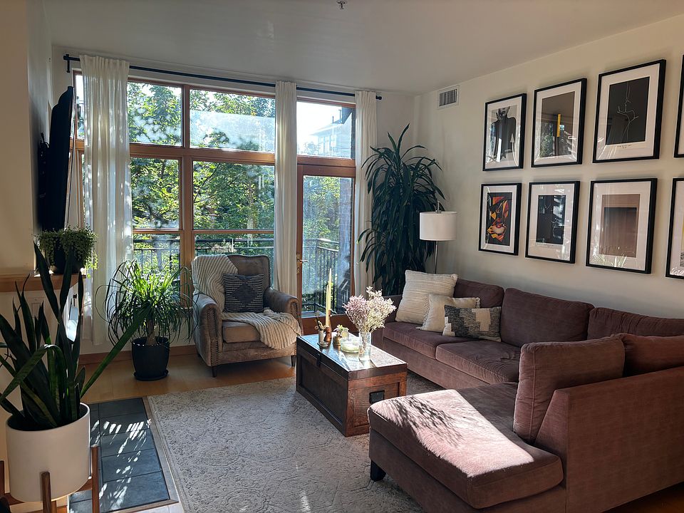 Main living area with attached balcony overlooking Jamison Square park.