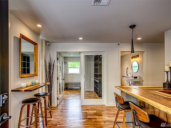 The inviting entrance leads into the welcoming reception area.  New acacia flooring runs throughout the building.  New doors and windows were installed to flood the space with light.