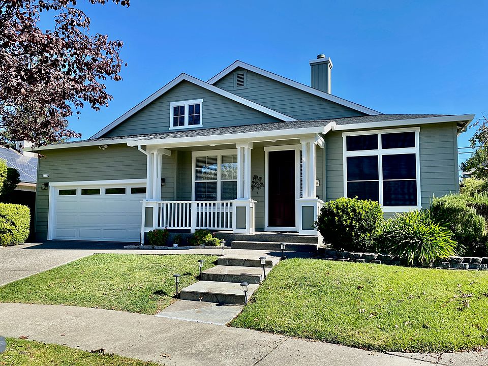 Front house view; new garage door, solar screens and exterior paint