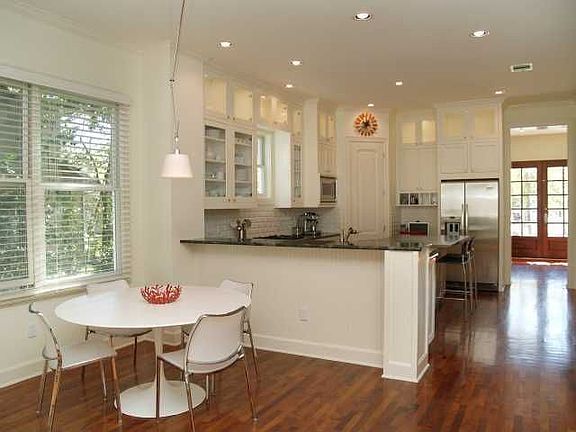 Breakfast area with morning light (eastern windows), open to kitchen