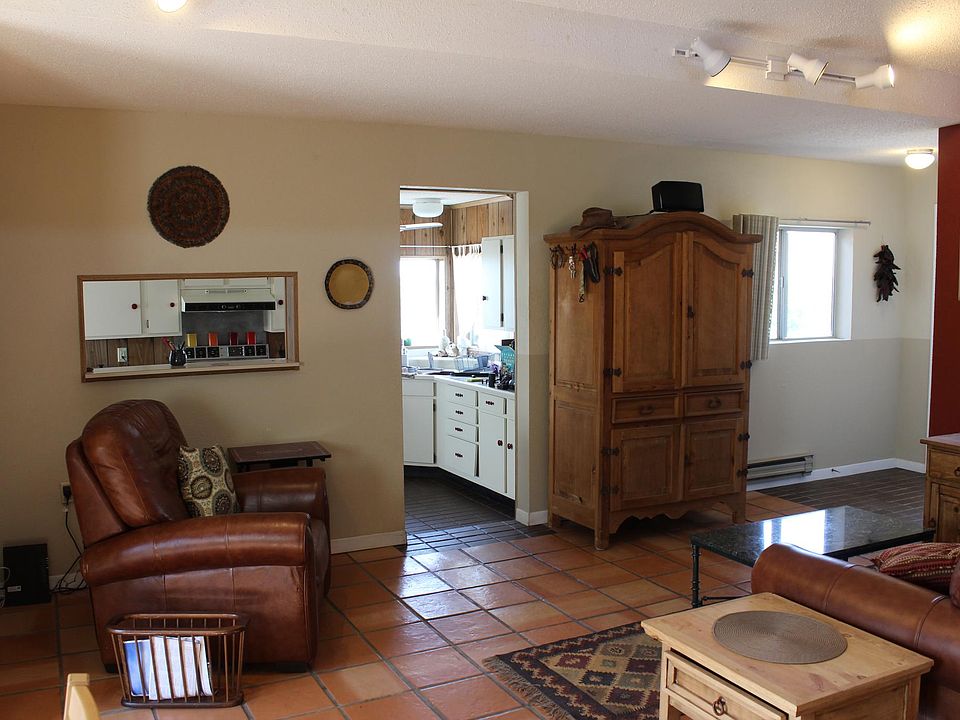 House has a great room with a high ceiling that adjoins the kitchen