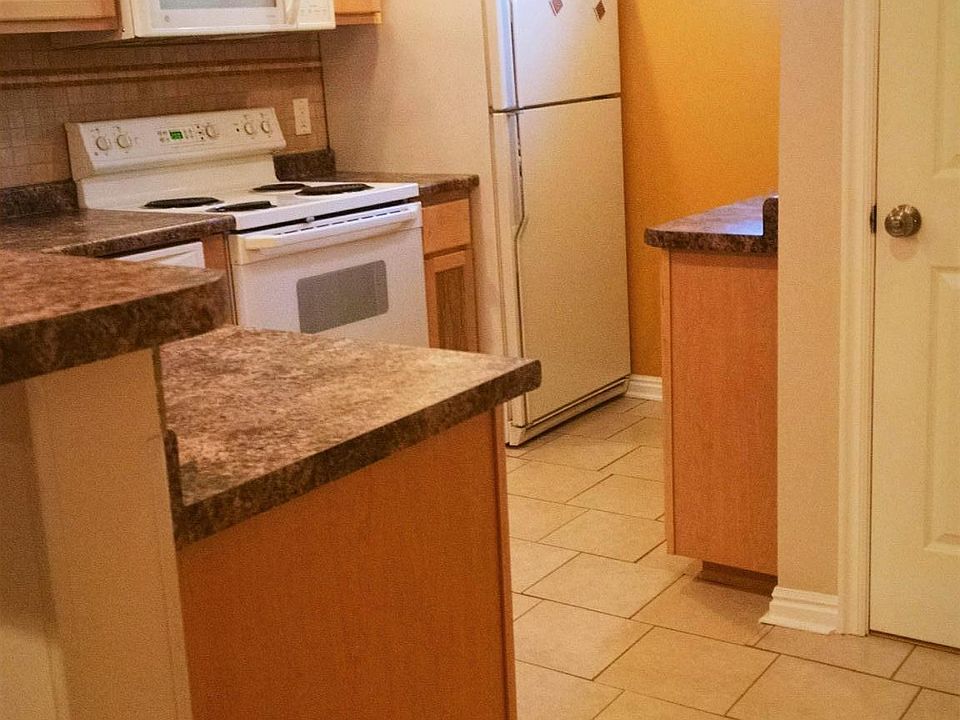 Kitchen area and entry. Tons of cabinet space.