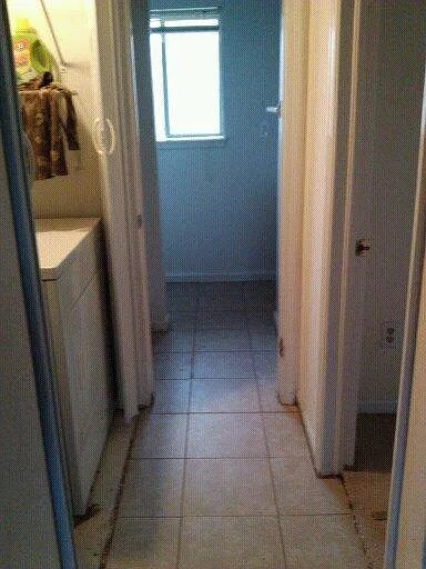 Hall to downstairs bath and washer/dryer area