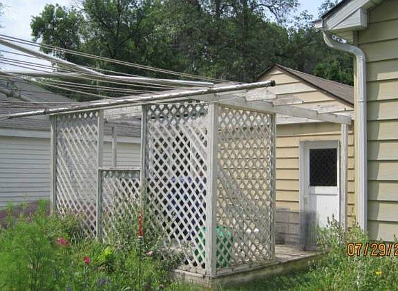 Pergola behind the garage.