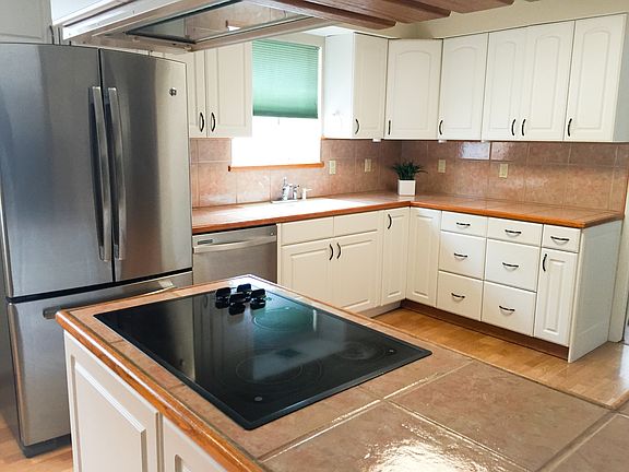 Updated kitchen with new white cabinets, new stainless steal