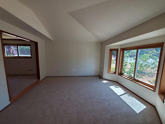 Living room with vaulted ceilings