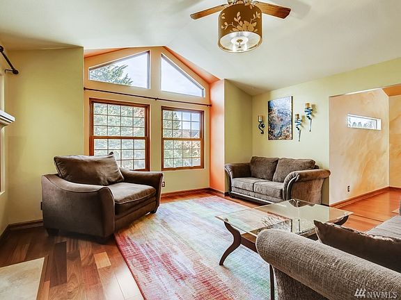 Large living room with vaulted ceilings and tons of natural lights