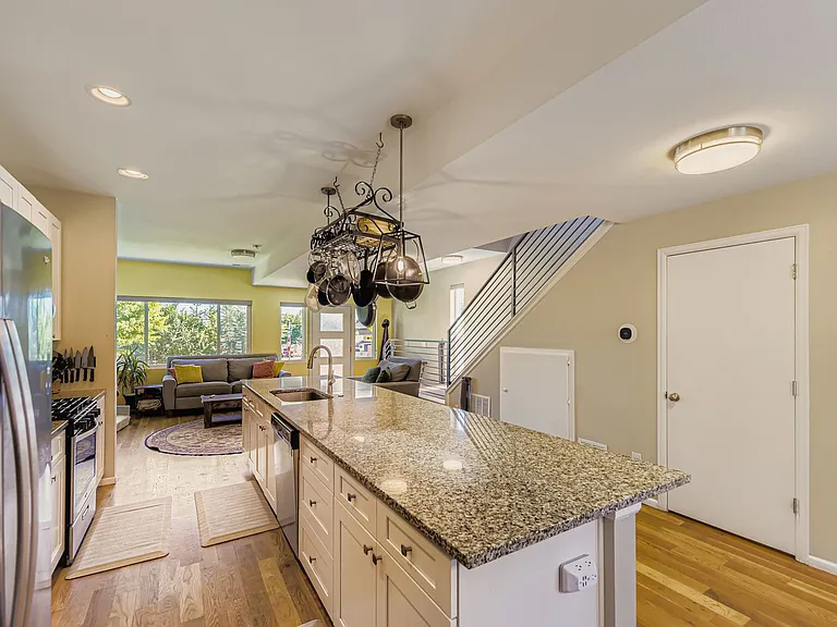Open concept kitchen with downstairs 1/2 bathroom.