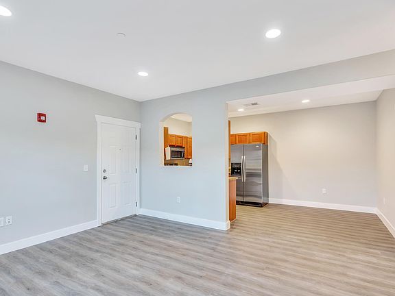 New floors throughout condo, no carpet! Open concept with large living room and dining area next to kitchen.