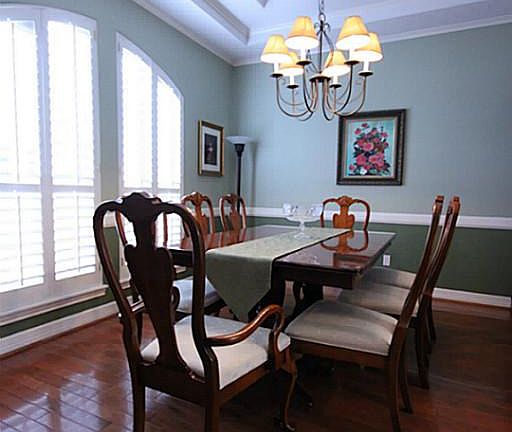To your left is the formal dining room. It is elegant and large.