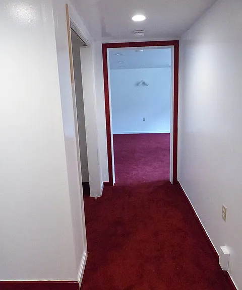 hallway looking from livingroom toward the bedroom, closet on the left