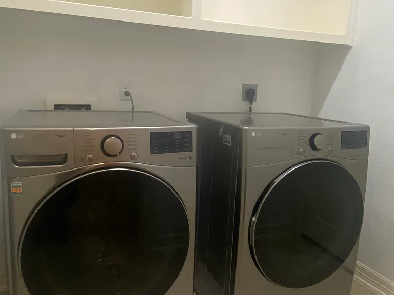 Dedicated laundry room complete with a brand-new washer and dryer _ included with your rental!