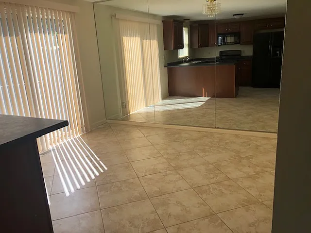 Bright eat in kitchen with tile flooring which is perfect for casual dining and everyday living. - 10 Andover Down