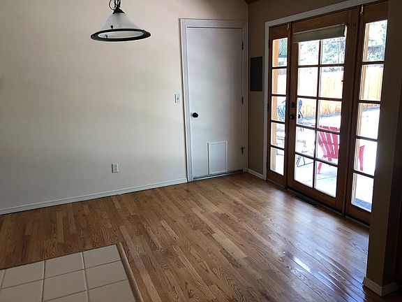 Dining area doors to garage and backyard