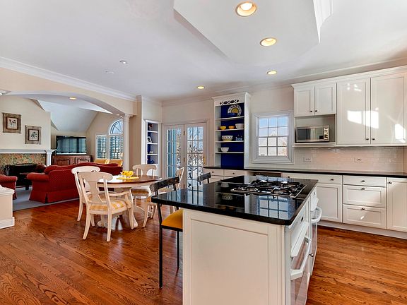 The kitchen is spacious and opens to a stunning family room with gorgeous fireplace.  The flow is su