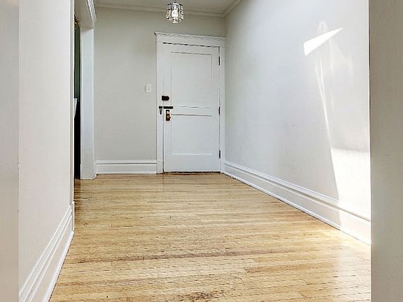 Open hallway with bright overhead skylight.