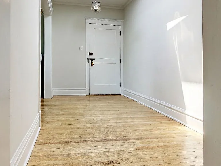 Open hallway with bright overhead skylight.