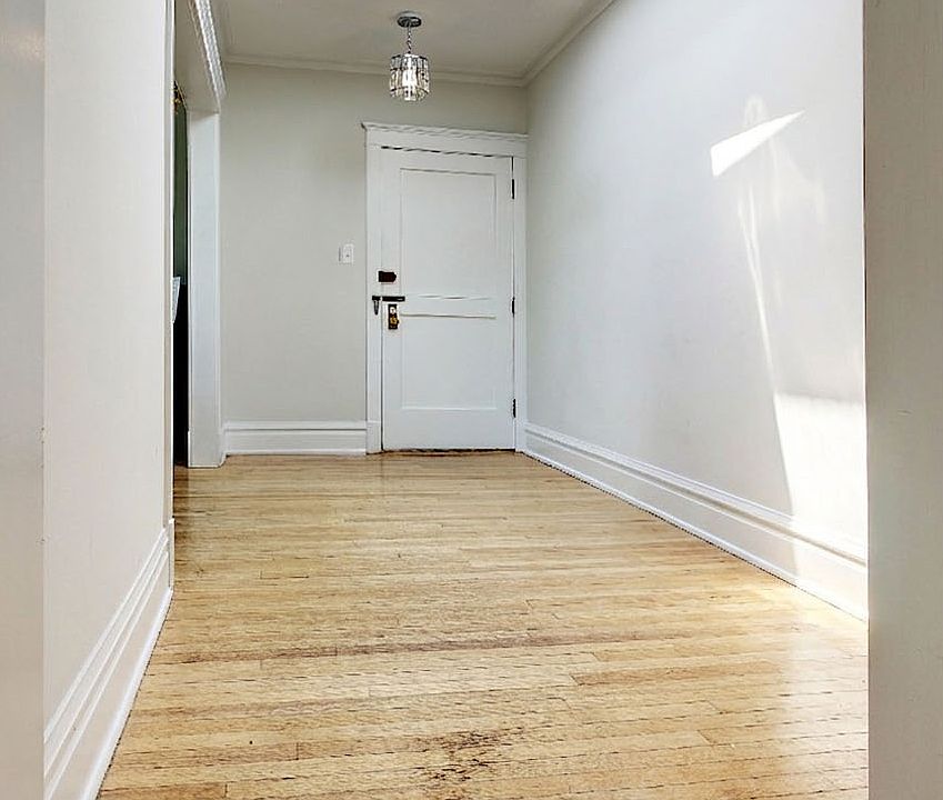 Open hallway with bright overhead skylight.