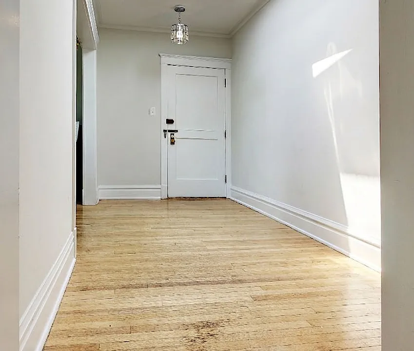 Open hallway with bright overhead skylight.