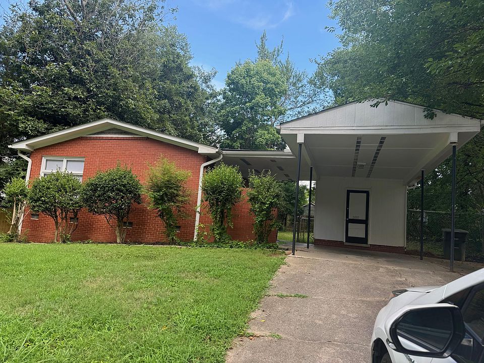 Front of the house with covered carport