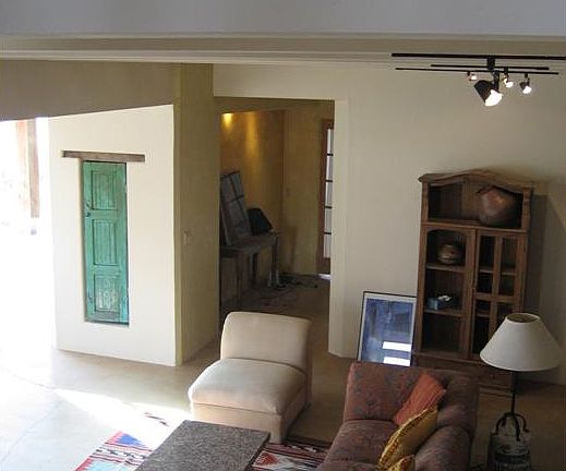 Looking down into living room from spiral stairs