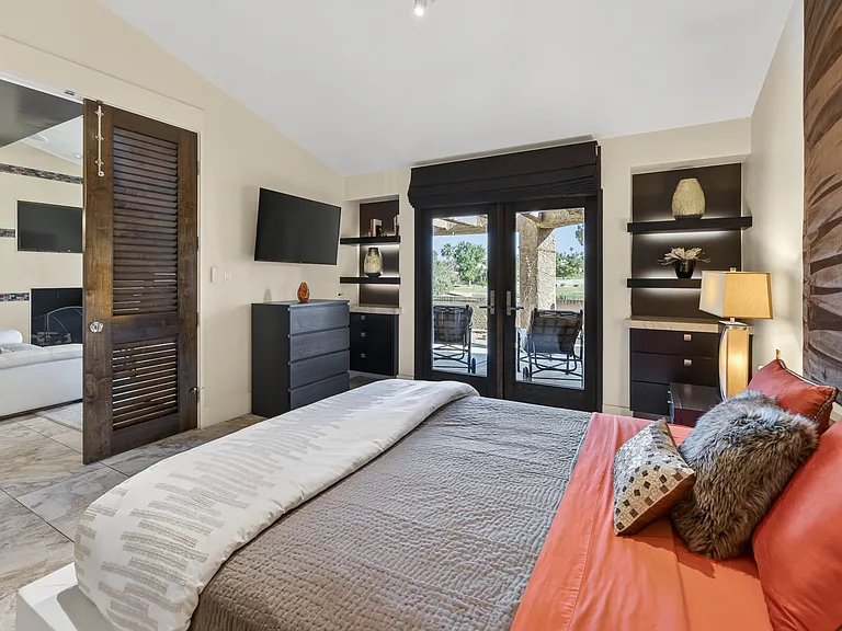 Under mount lighting in the master bedroom shelves and TV.