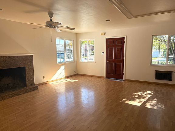 Living room with granite fireplace